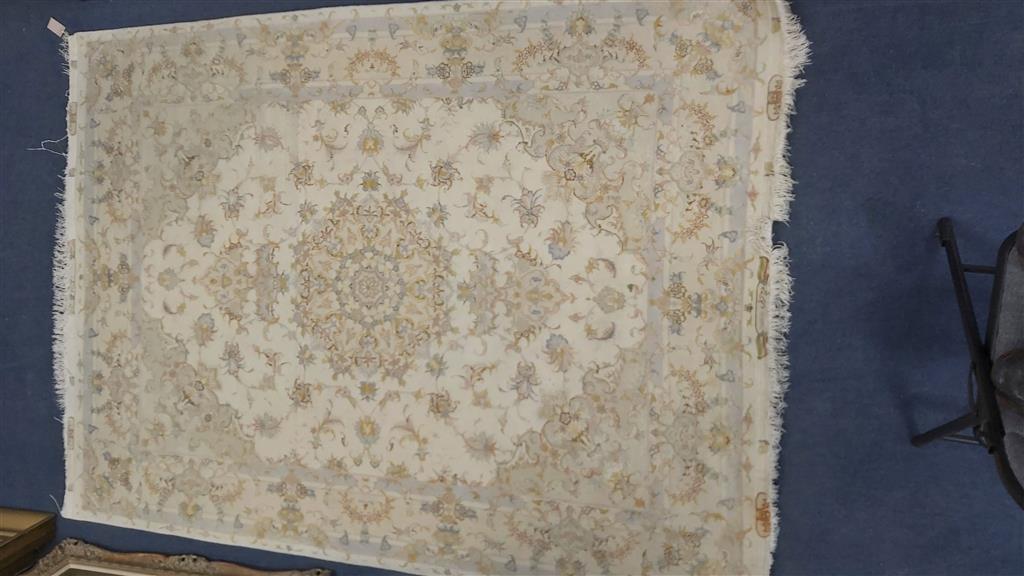 A Persian ivory ground part silk rug, 210 x 150cm